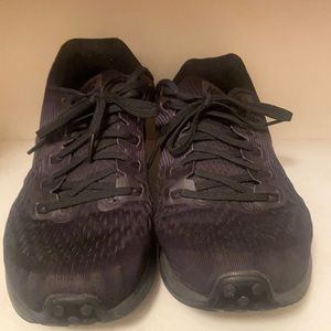 Women running Nike gym shoe